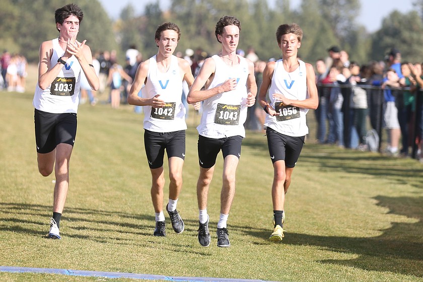 JASON ELLIOTT/Press
Coeur d'Alene senior Gabriel Heule (1043) takes the lead as teammates Wyatt Carr (1033), Rowan Henry (1042) and Wyatt Morgenstern (1056) follow in the final moments of the boys 6A District 1 championship race at The Course in Spokane Valley.