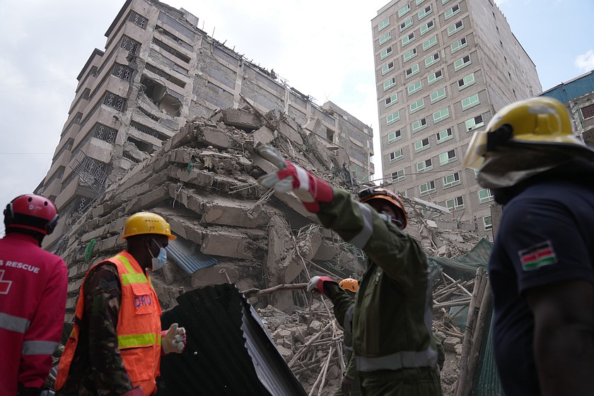 Security forces and civil defense work after a multi-story building collapsed in Nairobi, Kenya, Friday, Oct. 23, 2026. (AP Photo/Brian Inganga)