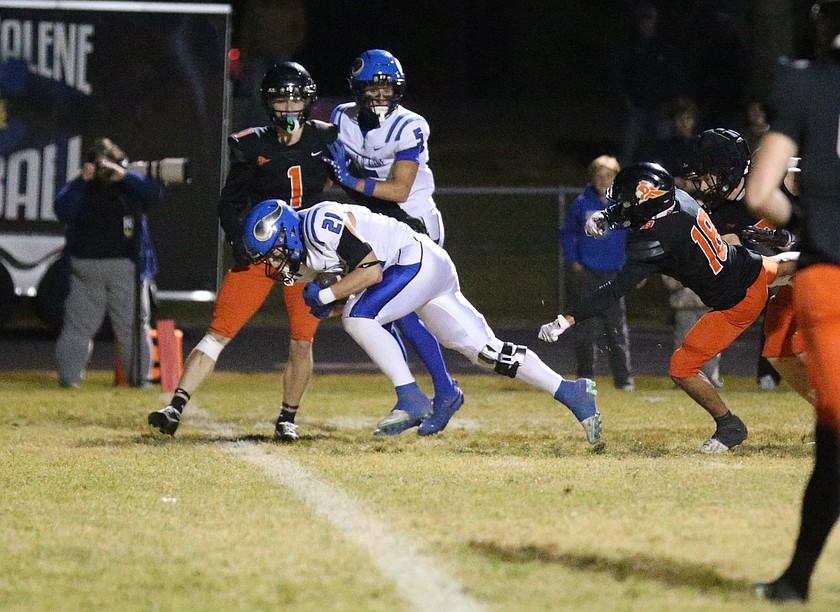 MARK NELKE/Press
Coeur d'Alene senior Bear Coleman (21) barrels into the end zone from 10 yards out against Post Falls in the second quarter on Friday night at Trojan Stadium.