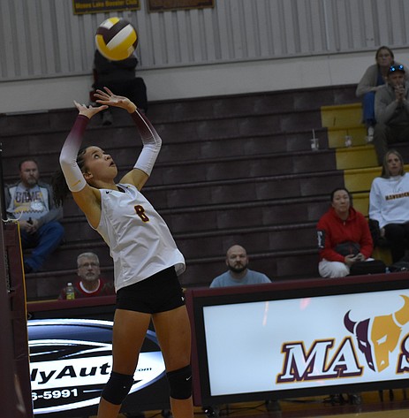 Moses Lake junior Allison Bond sets the ball for her teammates early in Thursday's game against Wenatchee.