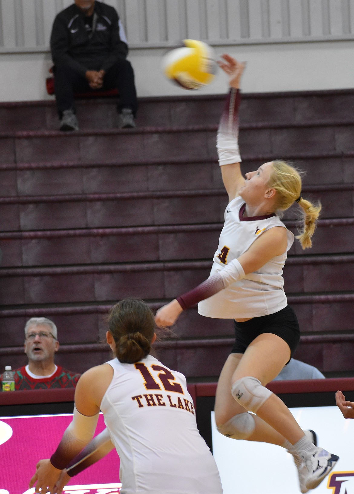 MLHS junior Hadley Whittall spikes the ball over the net for a kill during the game against Wenatchee.