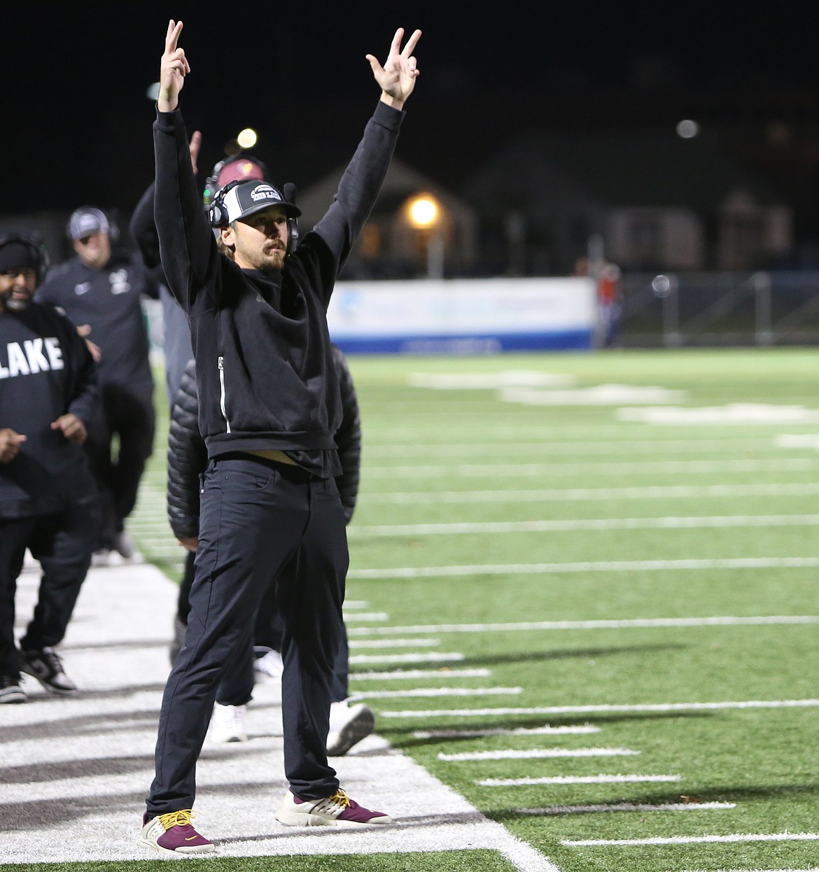 The Moses Lake Mavericks Head Coach Kyler Haneberg reacts to an Elijah Burns touchdown on the sideline.