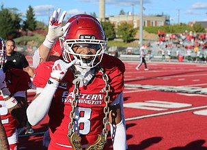 The Eagles' Ambrose Marsh celebrates an interception on the sideline against Cal Poly earlier this season.
