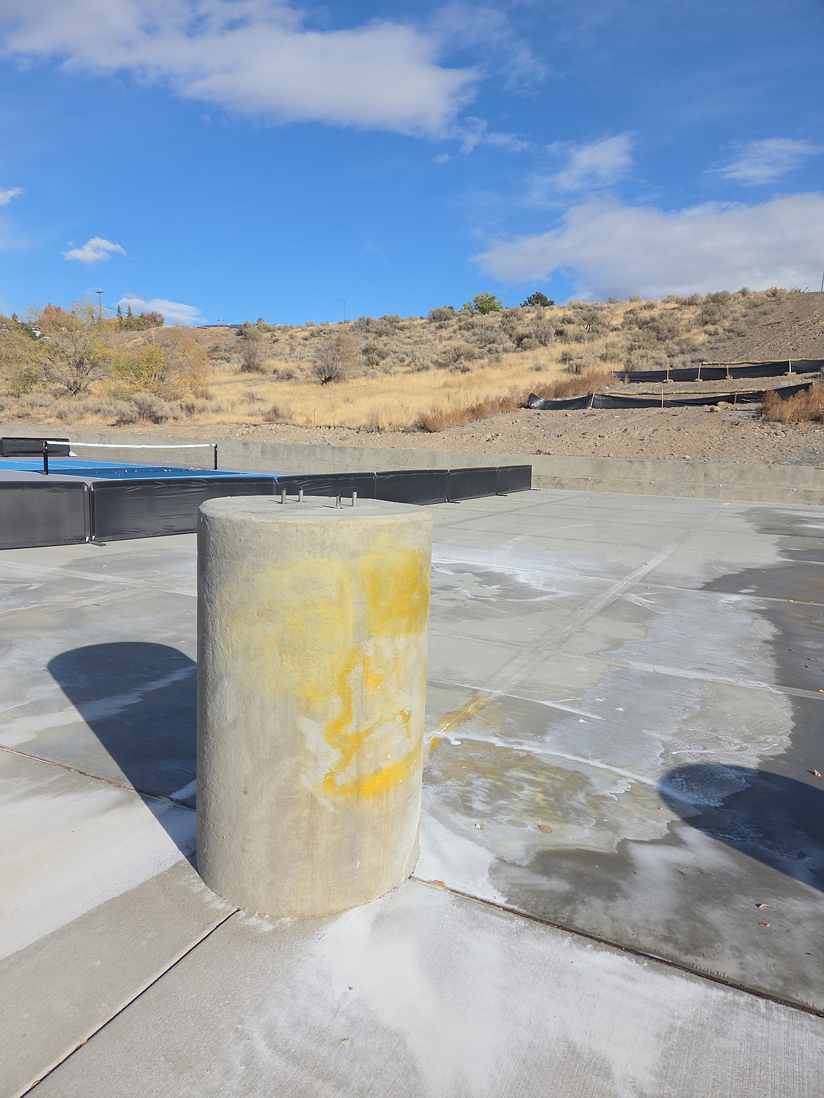 The City of Ephrata Public Works staff spent Tuesday afternoon power-washing the Ephrata Sports Complex after a group of vandals covered a portion of the facility in graffiti. The staff was able to remove most of the damage with some residual staining left.