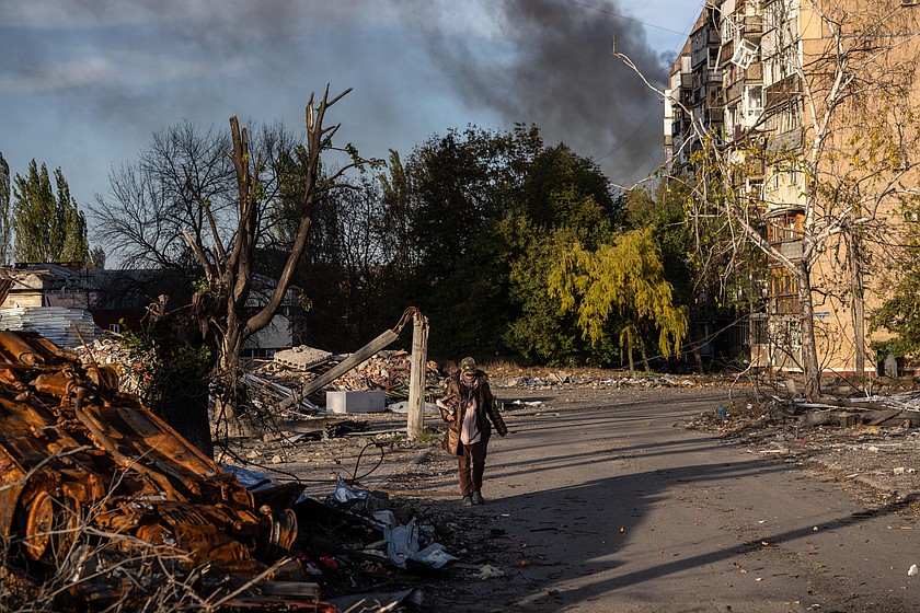 In this photo provided by Ukraine's 93rd Kholodnyi Yar Separate Mechanized Brigade press service and taken Tuesday, Oct. 27, 2026, a local resident leaves her damaged home after a Russian airstrike in Kramatorsk, Donetsk region, Ukraine. (Iryna Rybakova/Ukraine's 93rd Mechanized Brigade via AP)