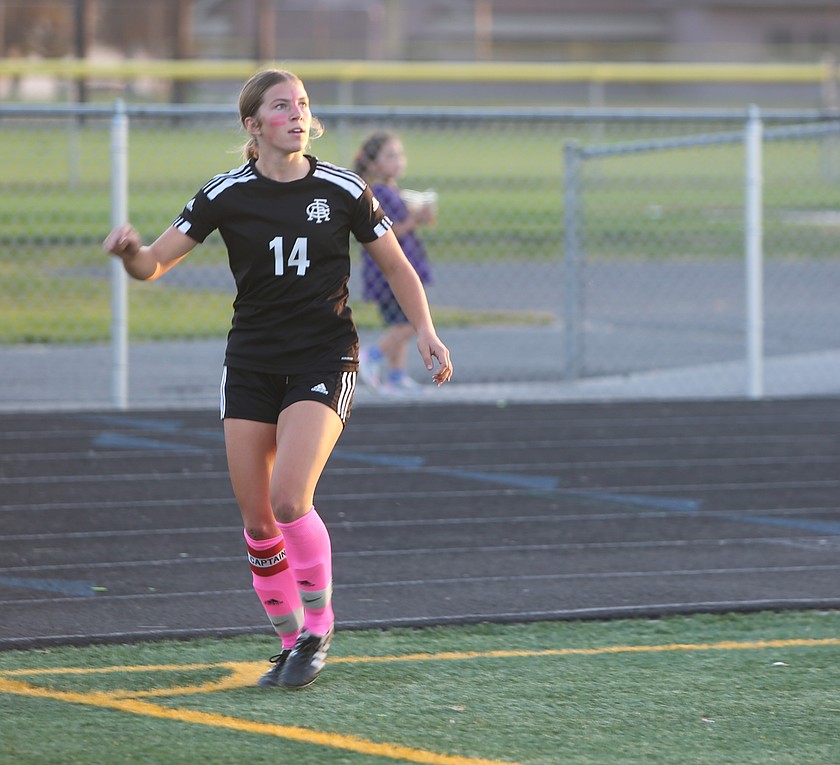 The Knights' Maggie Frank (14) watches the ball soar through the air after executing a corner kick. Frank scored her 33rd goal on Wednesday, which surpassed Royal's previous all-time single season record in its 7-0 win over Omak.