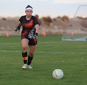 The Tigers' Aiyana Valle (00) kicks the ball back into play against Othello on Tuesday.