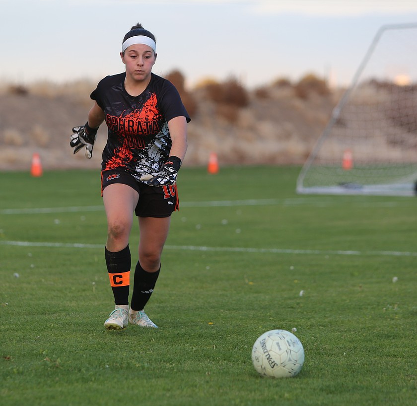 The Tigers' Aiyana Valle (00) kicks the ball back into play against Othello on Tuesday.