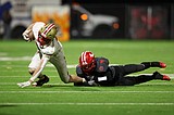 Sandpoint suffocates Minico in state playoff opener, 49-32