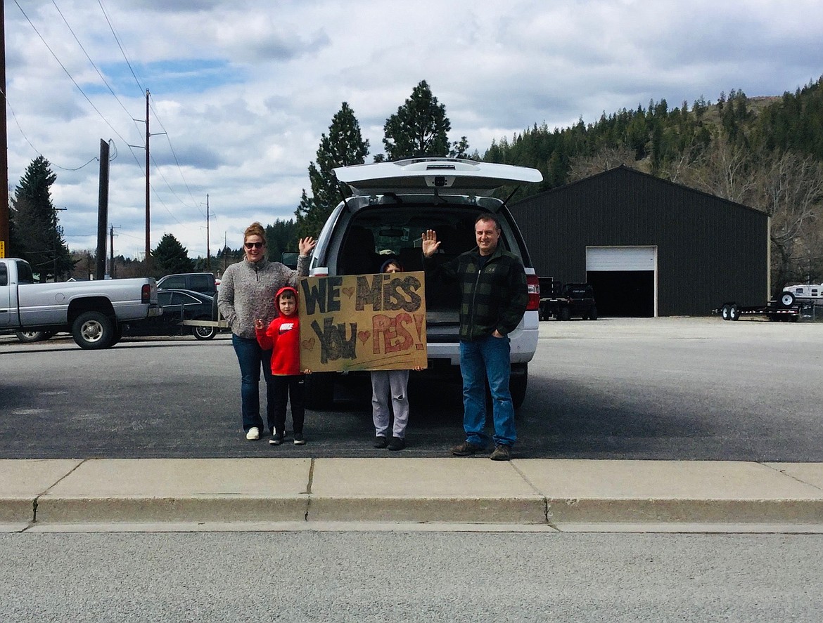 A family in Pinehurst shows the teachers from Pinehurst Elementary School some love during their “drive-by” event on Wednesday afternoon.