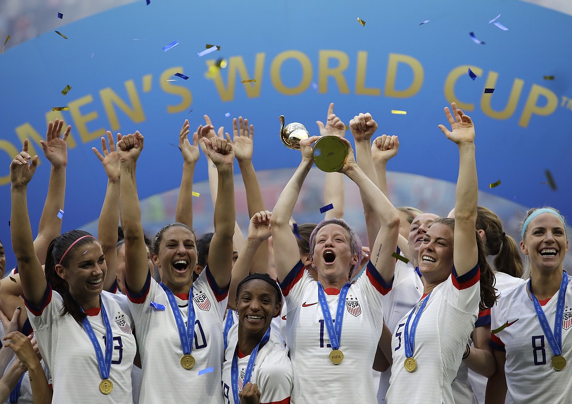 ALESSANDRA TARANTINO/Associated Press 
 The United States celebrates after winning the Women's World Cup in 2019 in France.